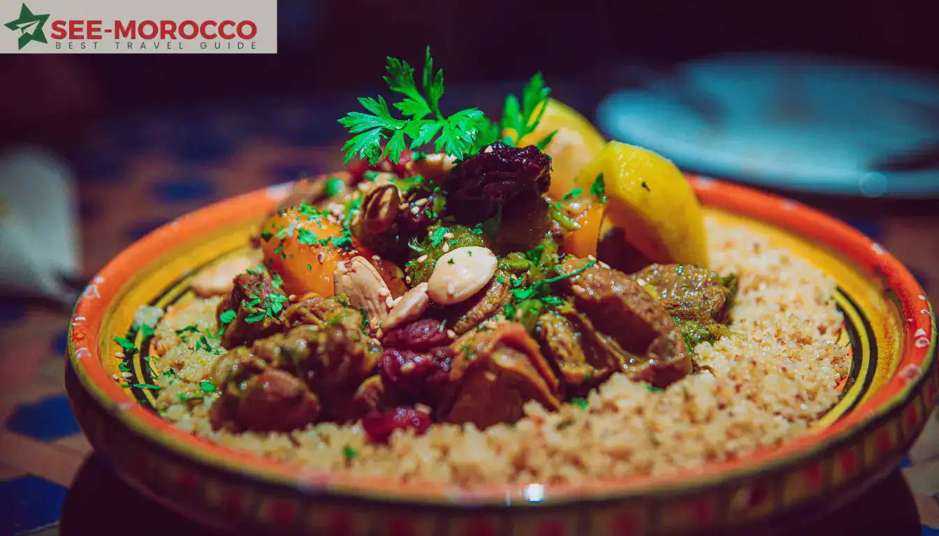 Authentic Moroccan couscous served on a large plate with lamb in the center and vegetables arranged around it