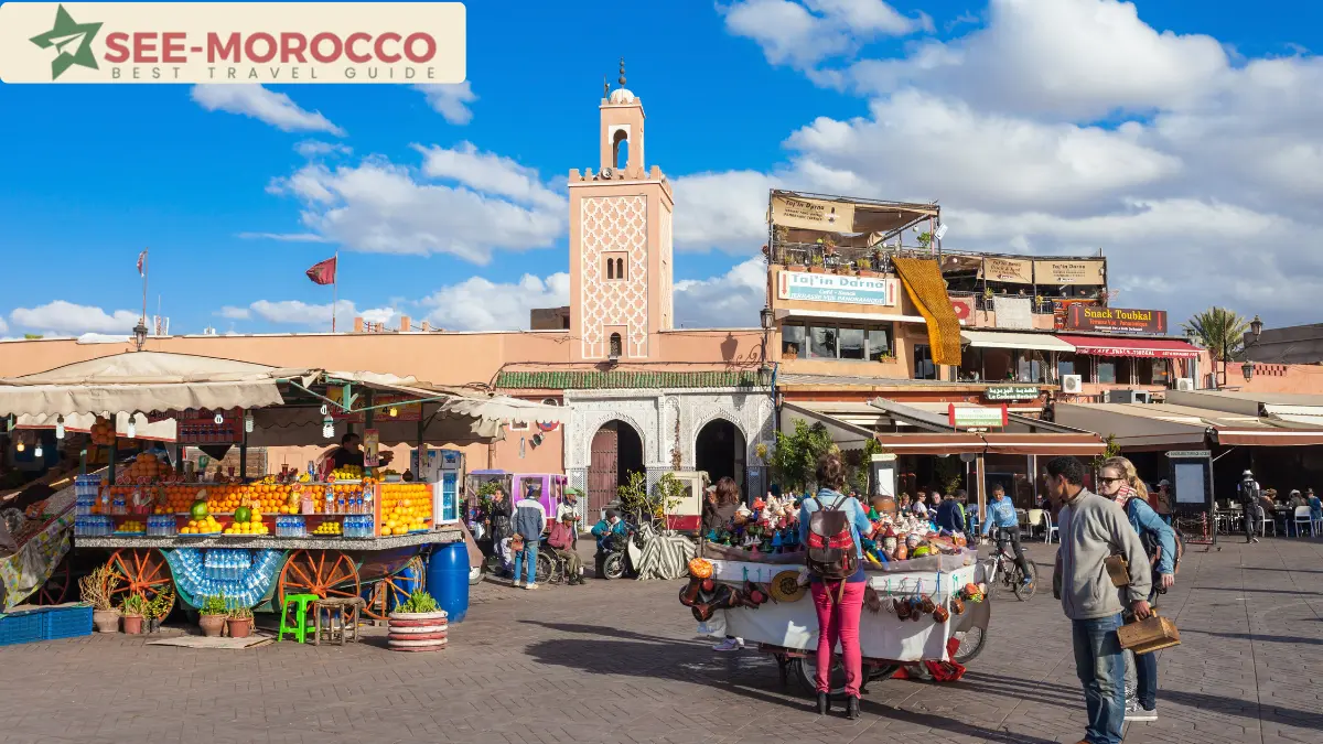 Jemaa el-Fna square in Marrakech by day with orange juice stalls