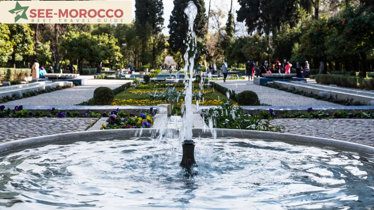 Fountain surrounded by blooming flower beds at Jnan Sbil Gardens in Fez