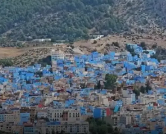 Chefchaouen blue city panoramic view Rif Mountains sunset Morocco