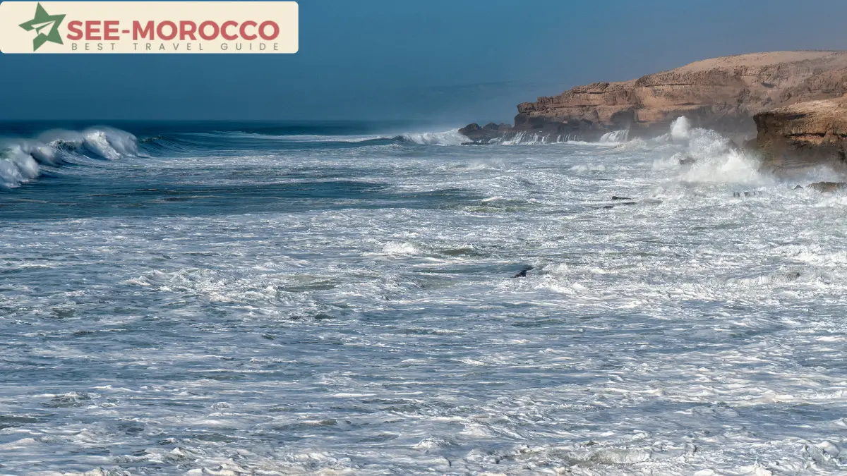 Morocco Atlantic coast strong waves surfer rocky cliffs