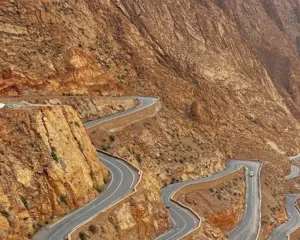 Dades Gorge Morocco — famous winding switchback road through the canyon Caption