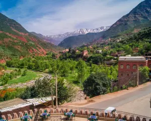 day trips from Marrakech — Ourika Valley green river and snowy Atlas peaks