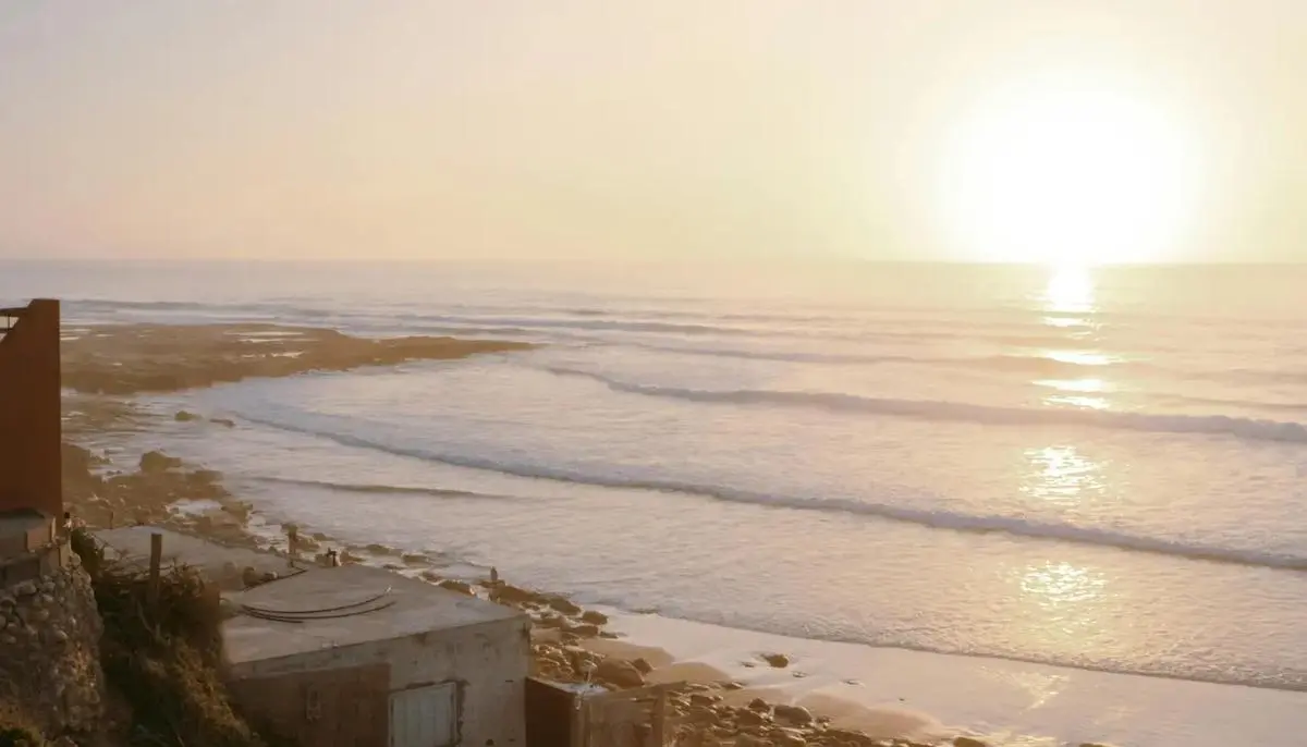Surf photography Morocco — golden sunset over Atlantic coast near Taghazout