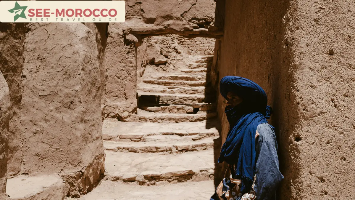 Local man in blue turban on the earthen stairways inside Ait Benhaddou ksar