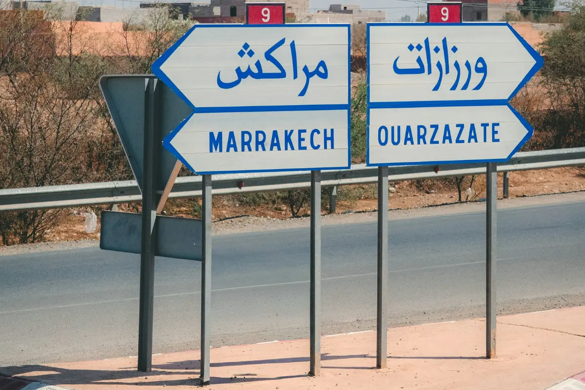 Morocco transportation safety — road signs to Marrakech and Ouarzazate