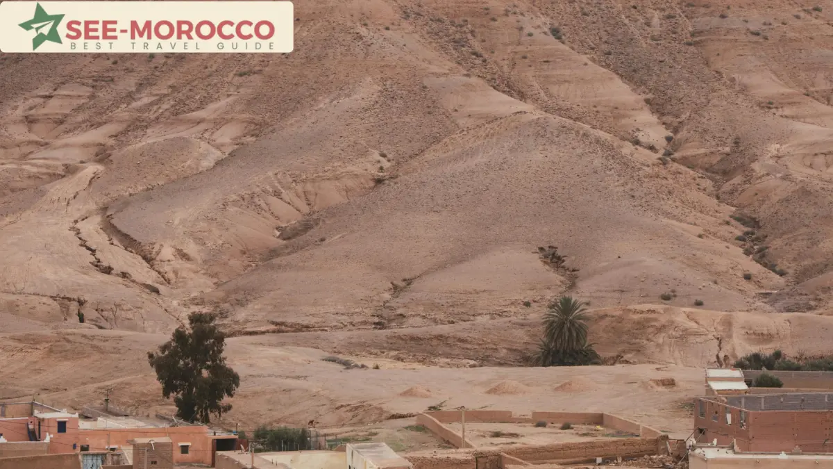 Dry hills and an earthen village in the Agafay Desert region Morocco