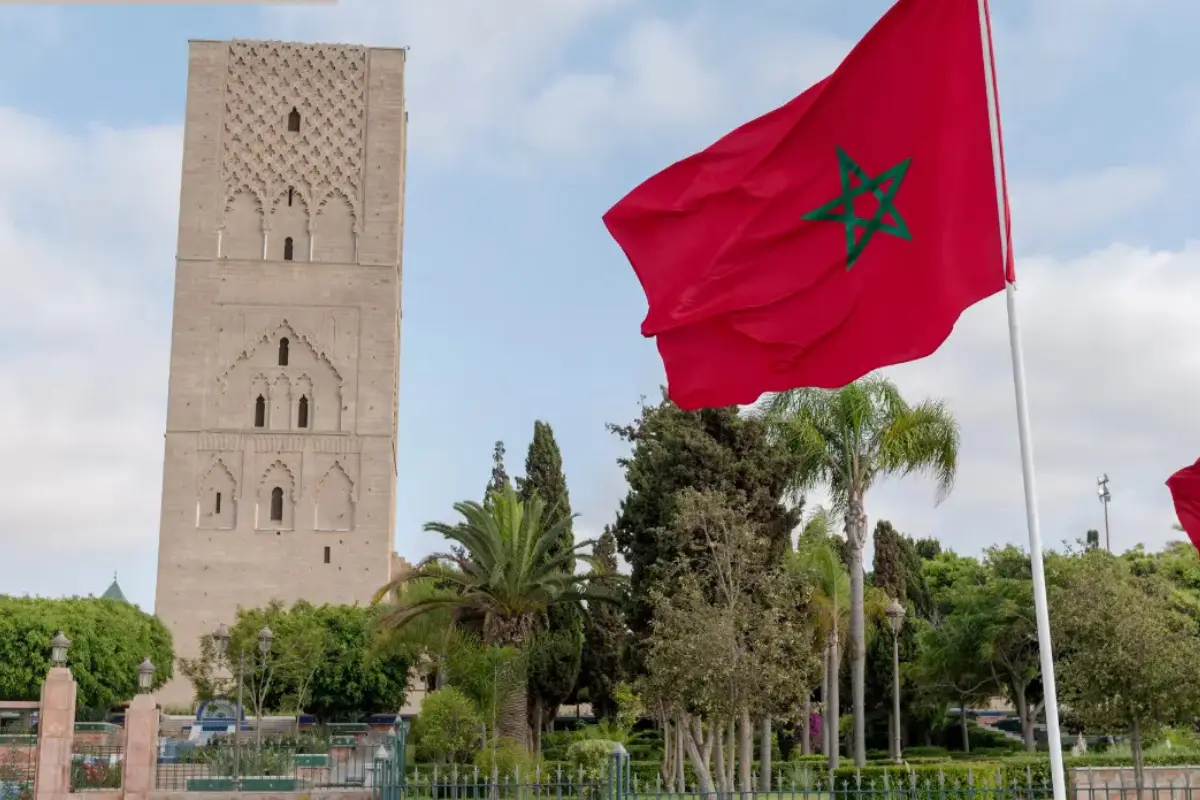 Private Morocco tours — Hassan Tower Rabat with Moroccan flags imperial cities route