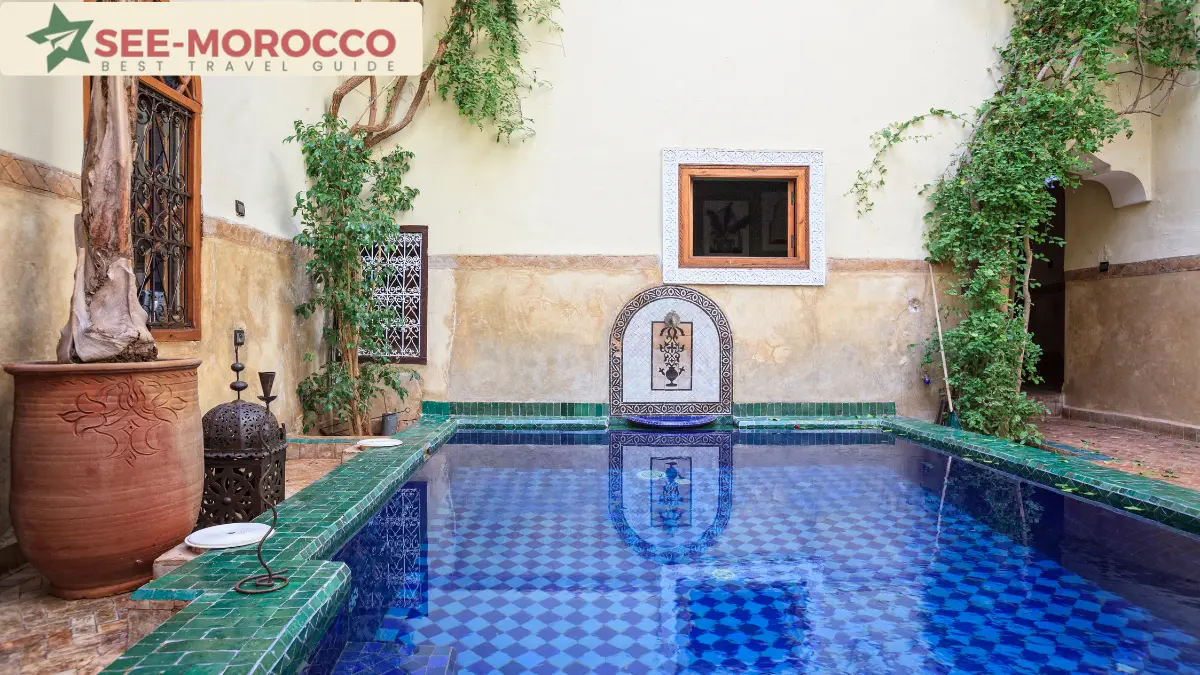 riad Marrakech traditional courtyard pool with zellij tiles