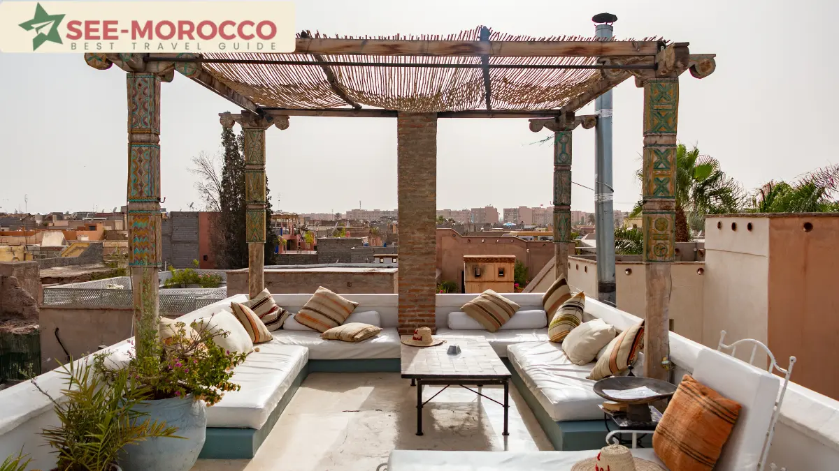 riad Marrakech rooftop terrace with pergola and Medina view